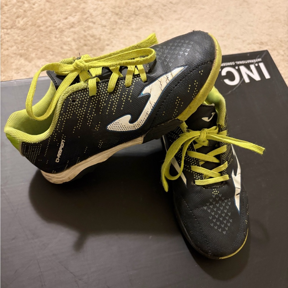 Kids Black and Green soccer shoes